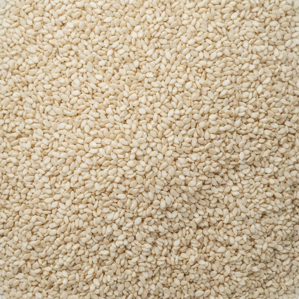 Heap of white hulled sesame seeds
